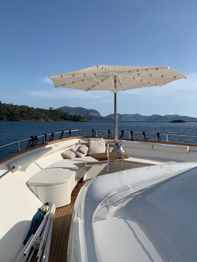a boat with a canopy on the water aboard HAG Yacht for Sale