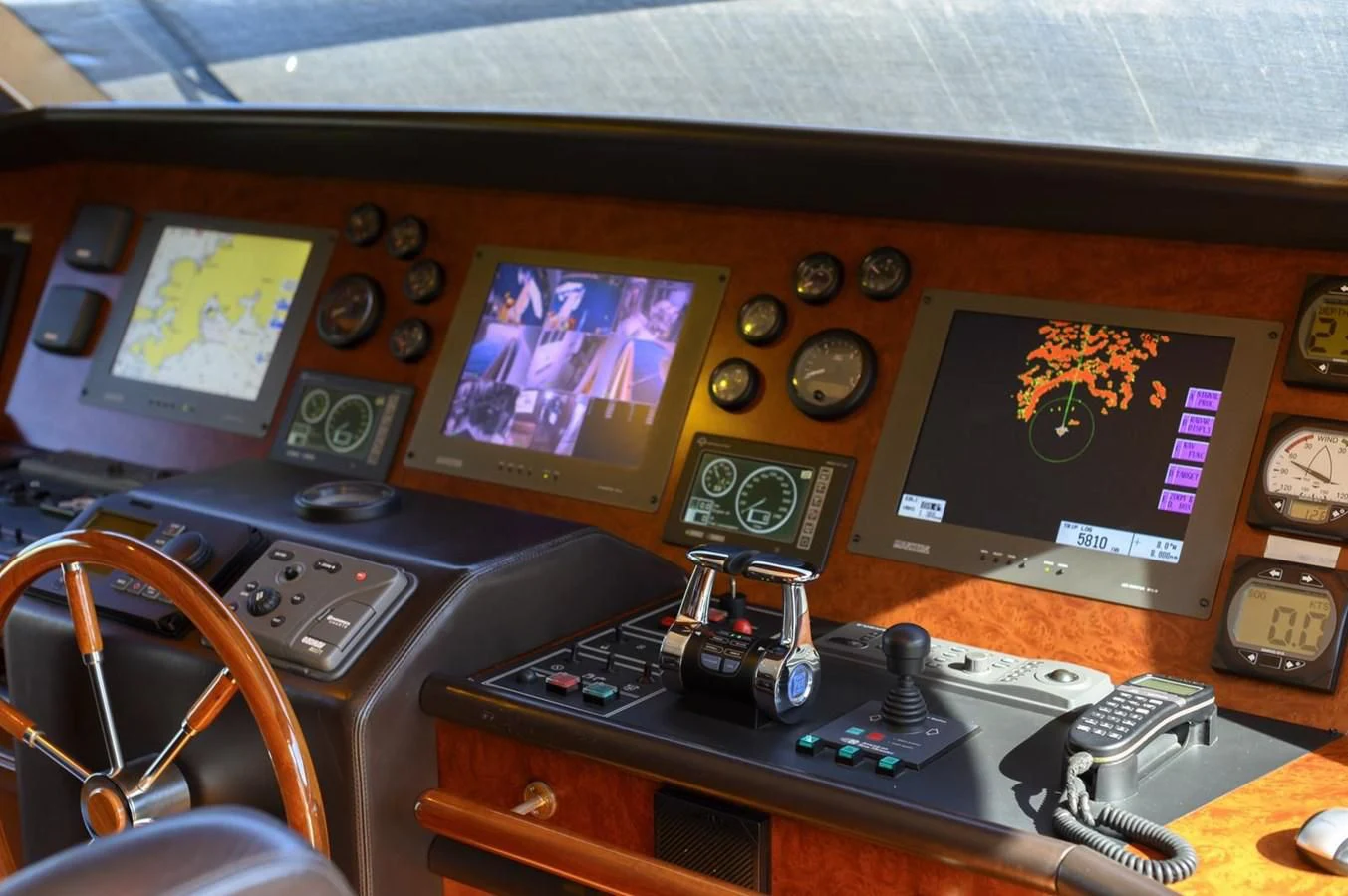 a desk with a computer and a television on it aboard HAG Yacht for Sale