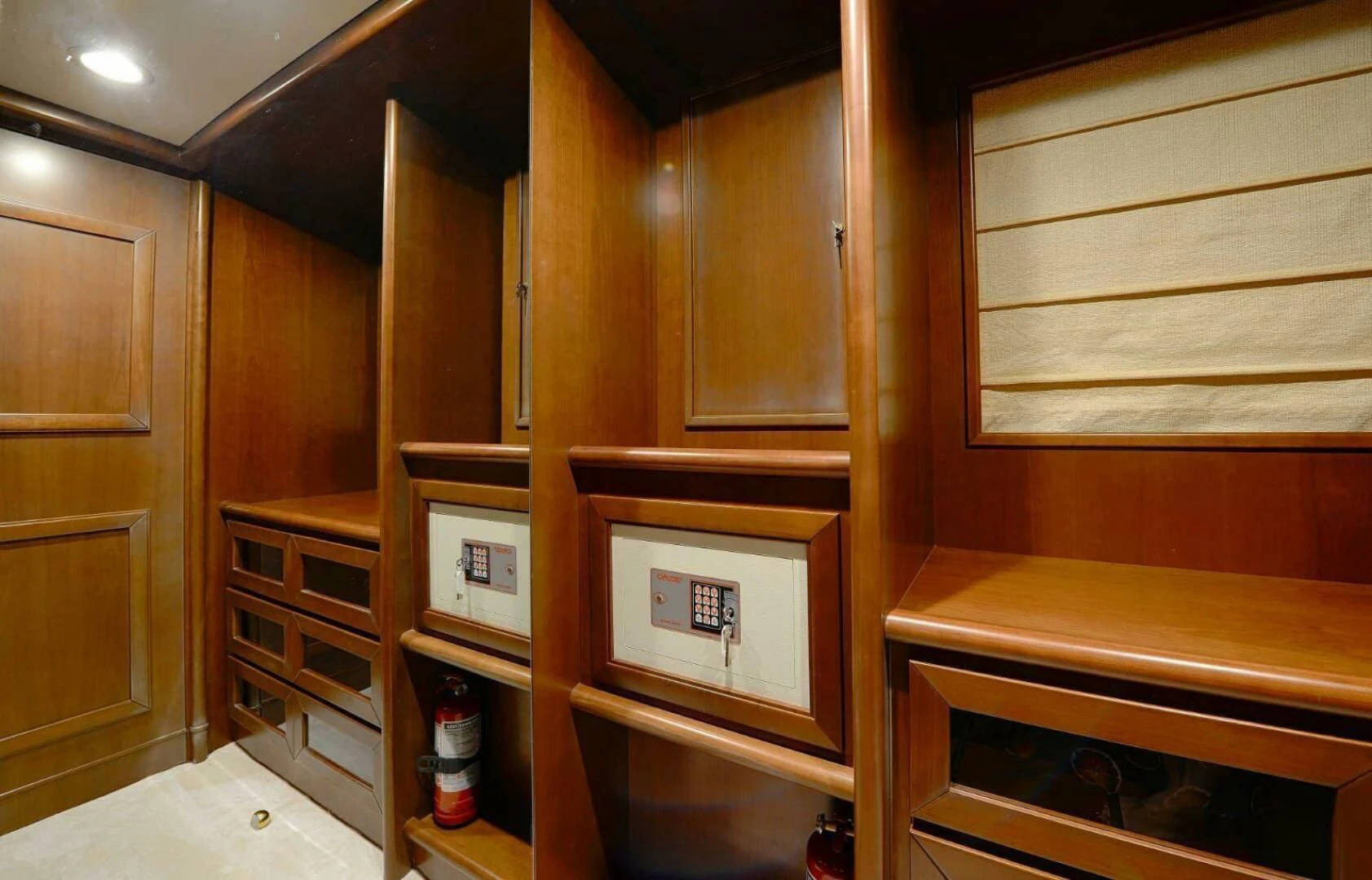 a room with wooden cabinets aboard HAG Yacht for Sale