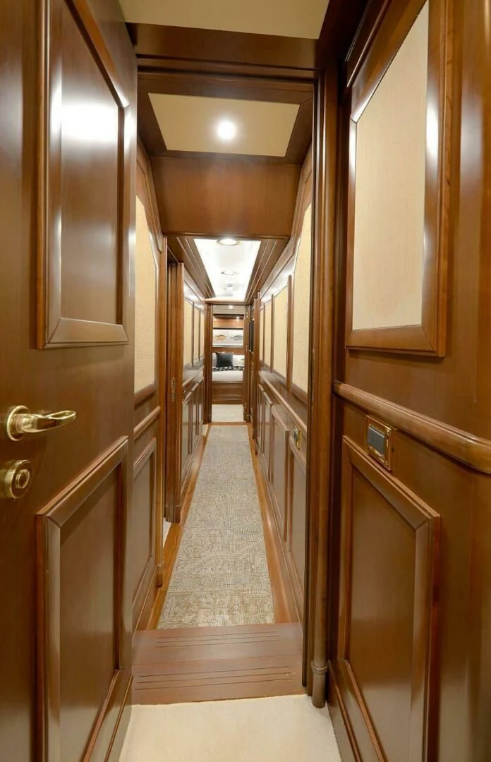 a hallway with wood doors aboard HAG Yacht for Sale