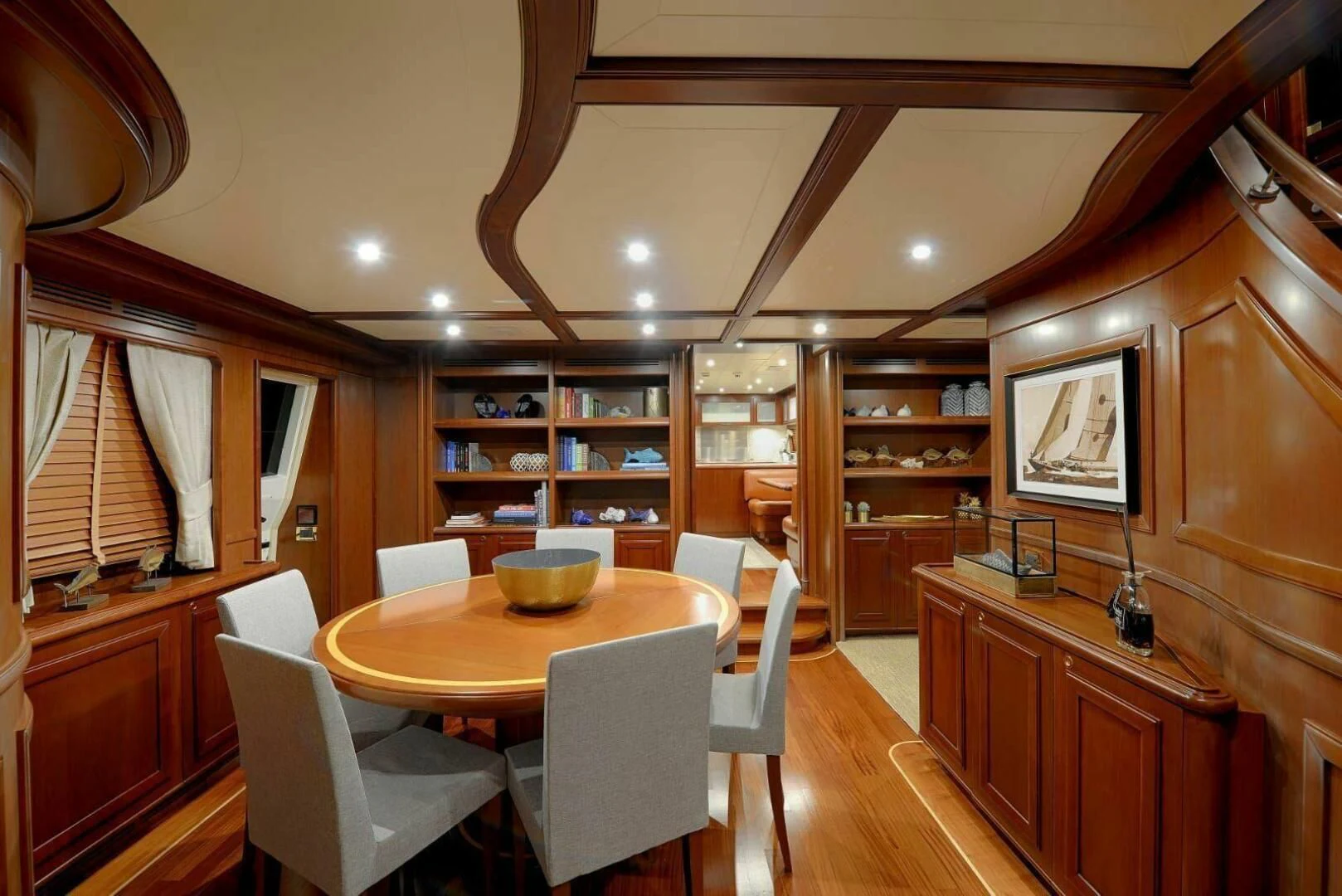 a dining room with a table and chairs aboard HAG Yacht for Sale