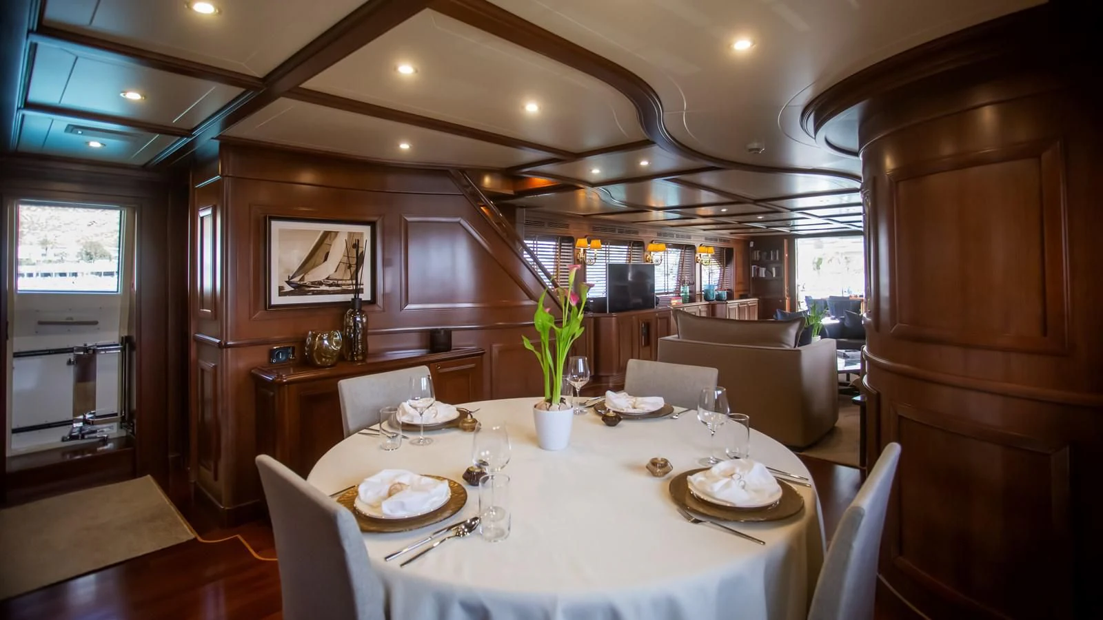 a dining room with a table set aboard HAG Yacht for Sale