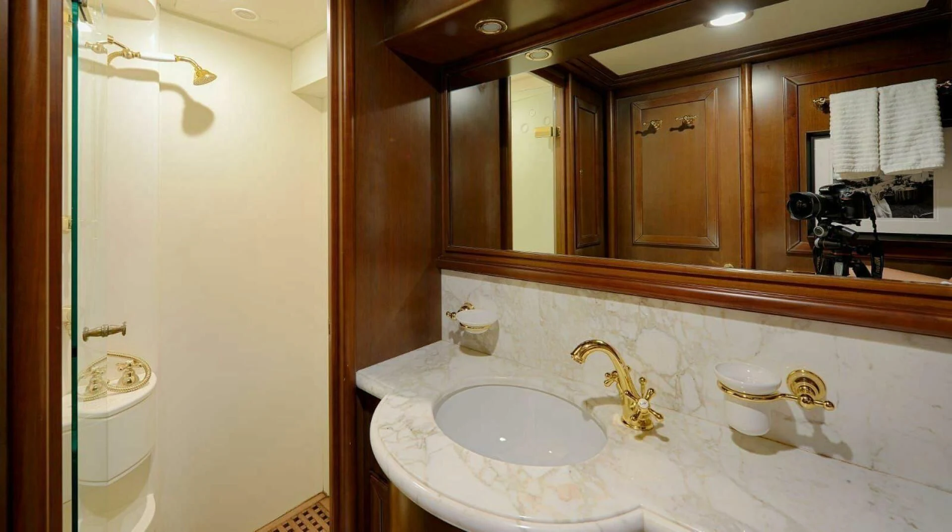 a bathroom with a large mirror aboard HAG Yacht for Sale