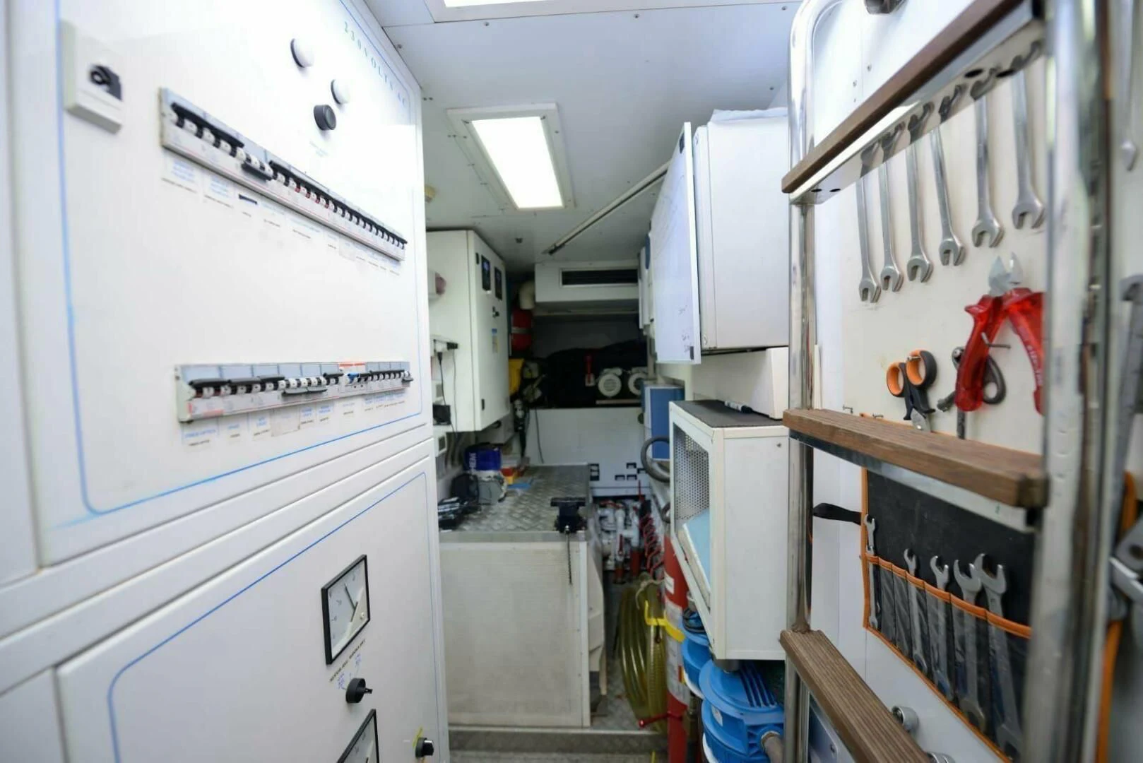 a room with shelves and tools aboard HAG Yacht for Sale