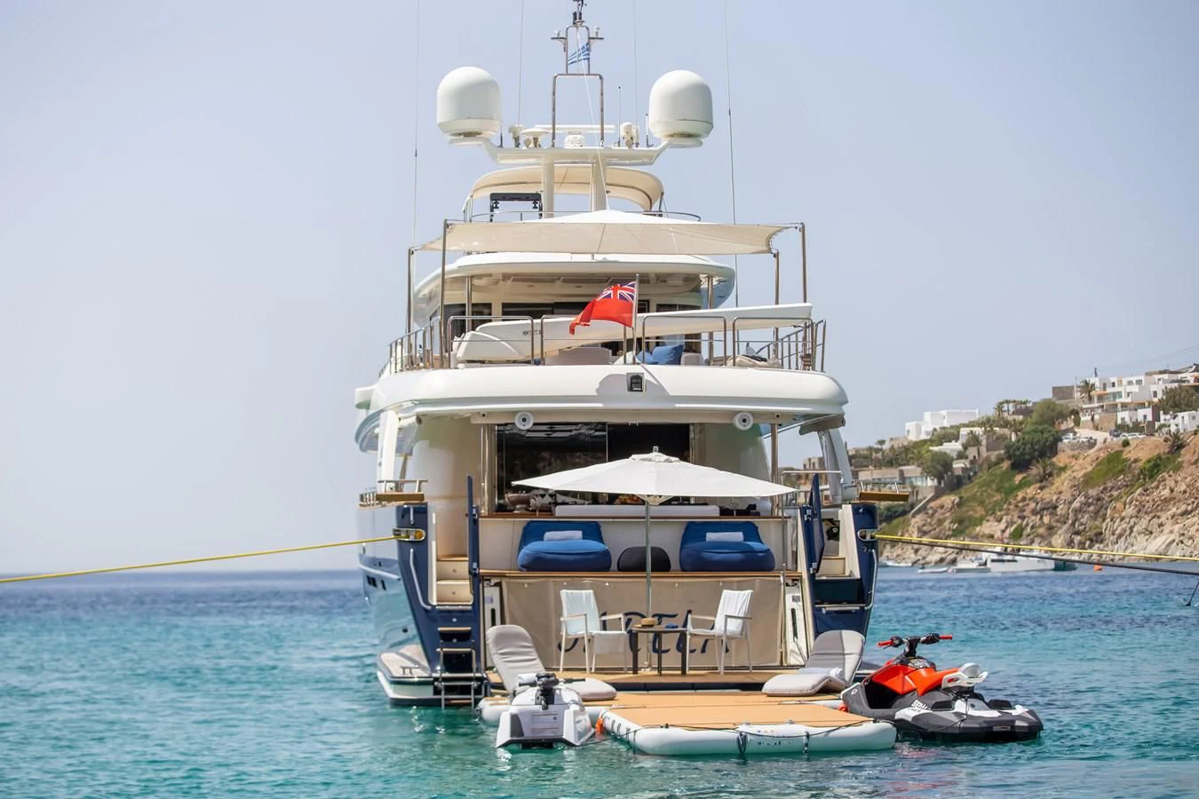 a large white ship docked aboard HAG Yacht for Sale