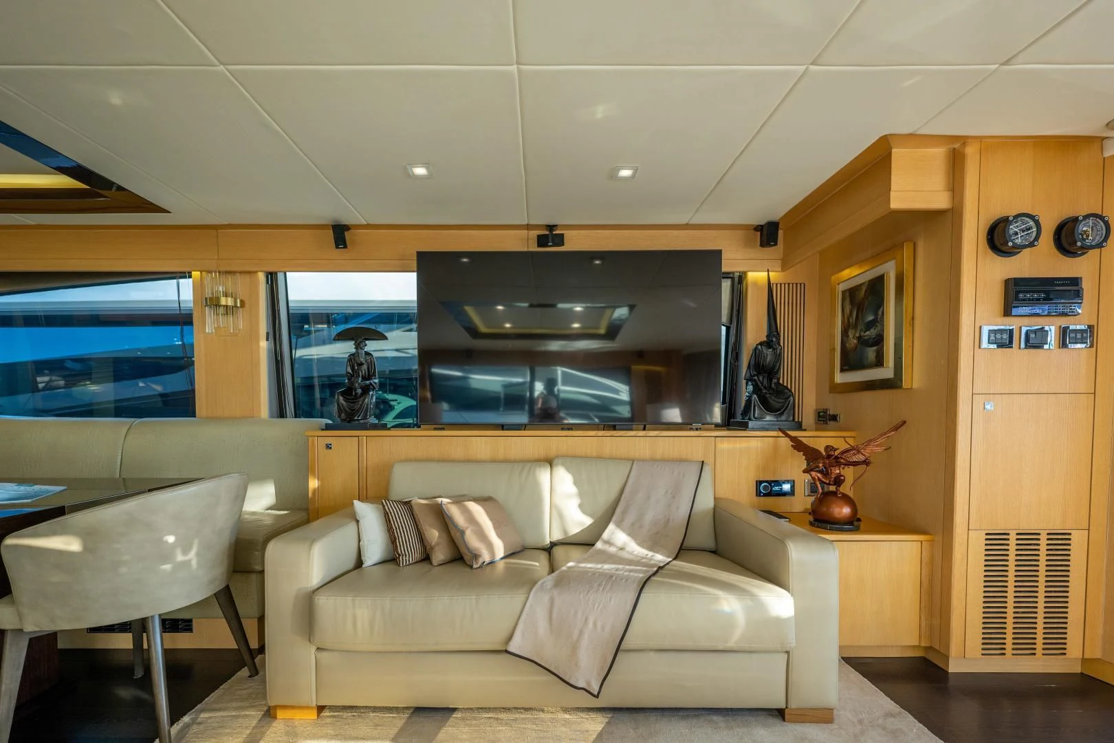 a living room with a couch and a tv aboard THE KING Yacht for Sale