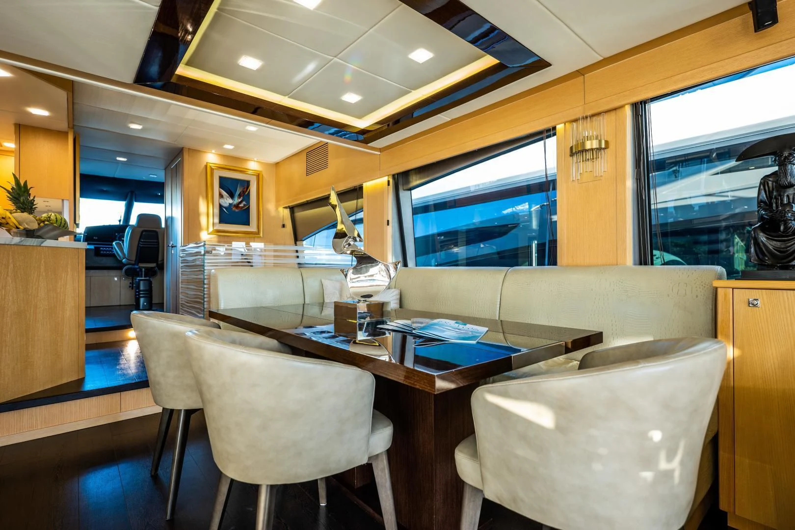a room with a table and chairs aboard THE KING Yacht for Sale