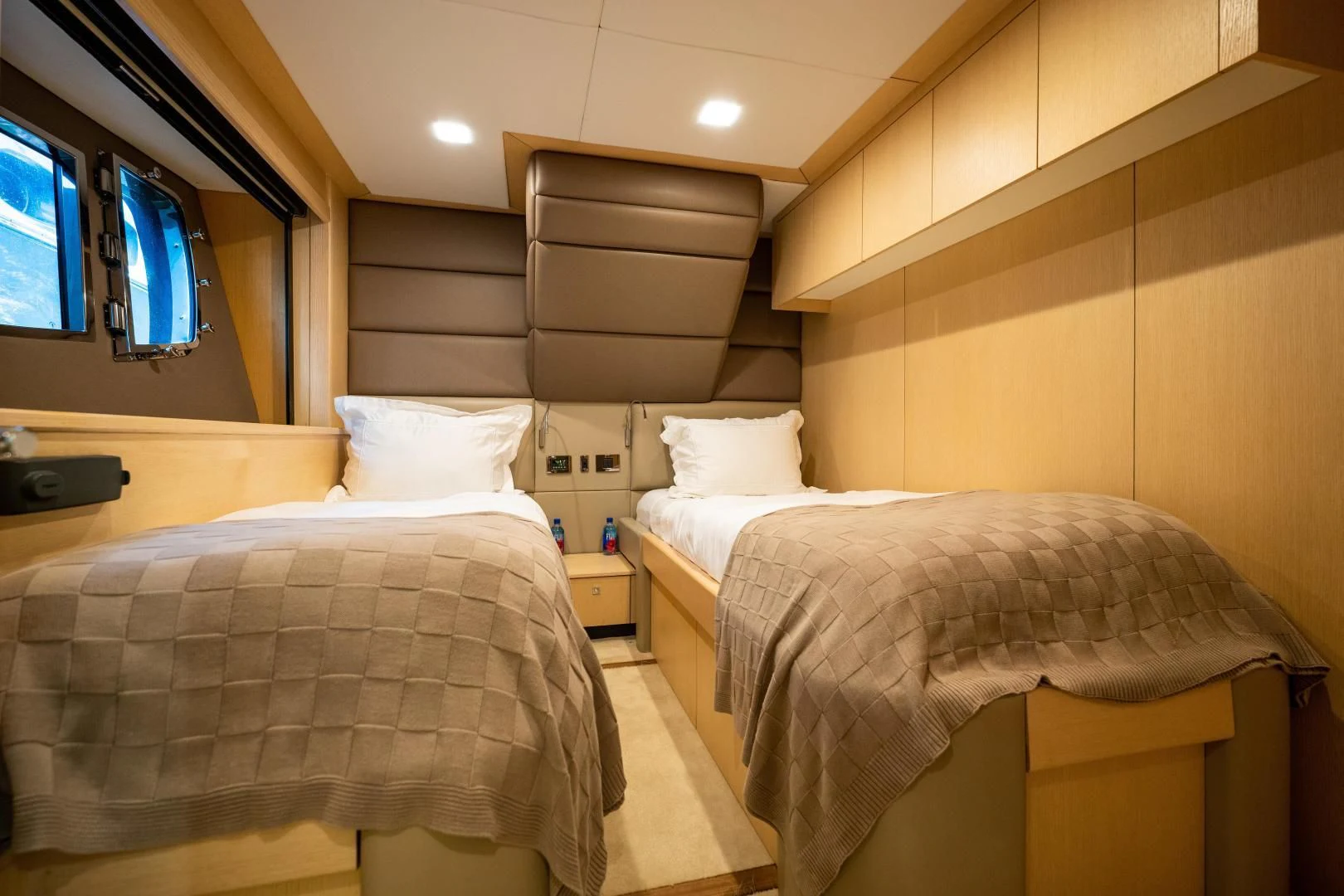 a couple of beds in a room aboard THE KING Yacht for Sale