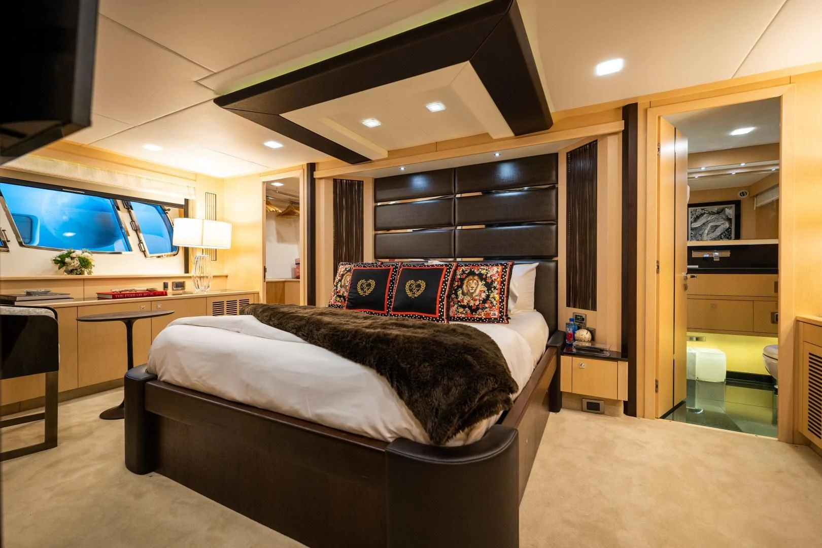 a bedroom with a bed and a tv aboard THE KING Yacht for Sale