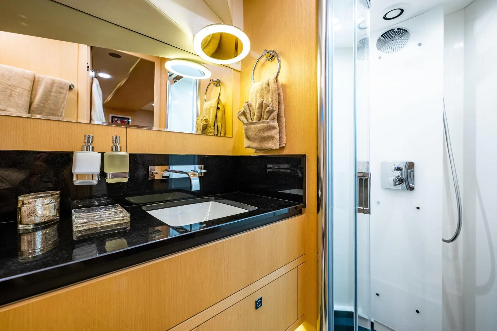 a bathroom with a sink and a mirror aboard THE KING Yacht for Sale