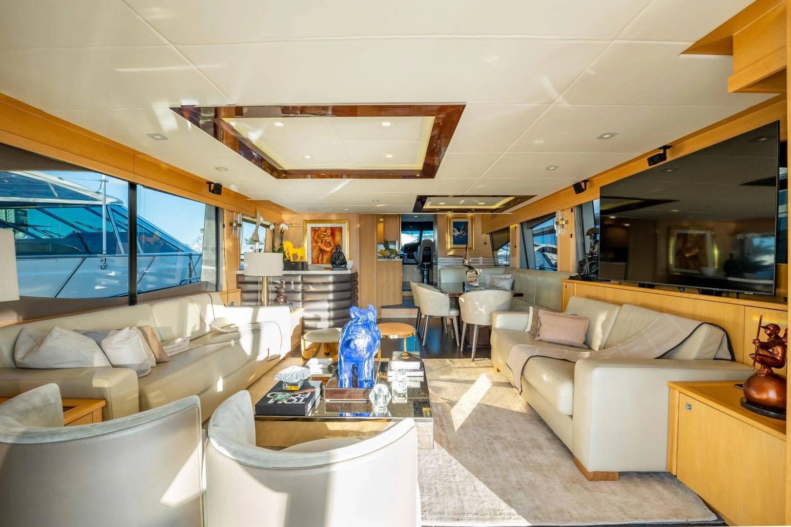 a living room with a large window aboard THE KING Yacht for Sale