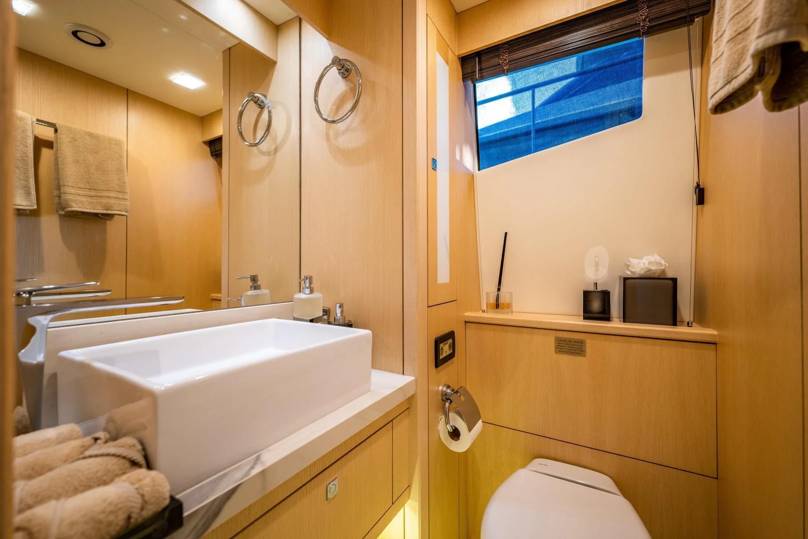 a bathroom with a tub sink and mirror aboard THE KING Yacht for Sale
