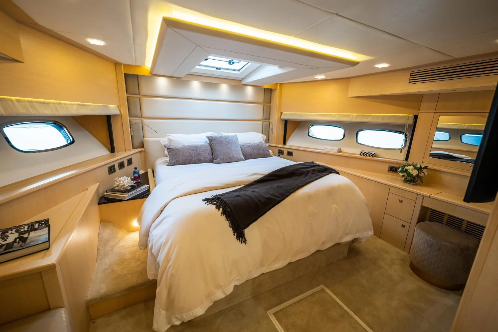 a room with a bed and a tv aboard THE KING Yacht for Sale