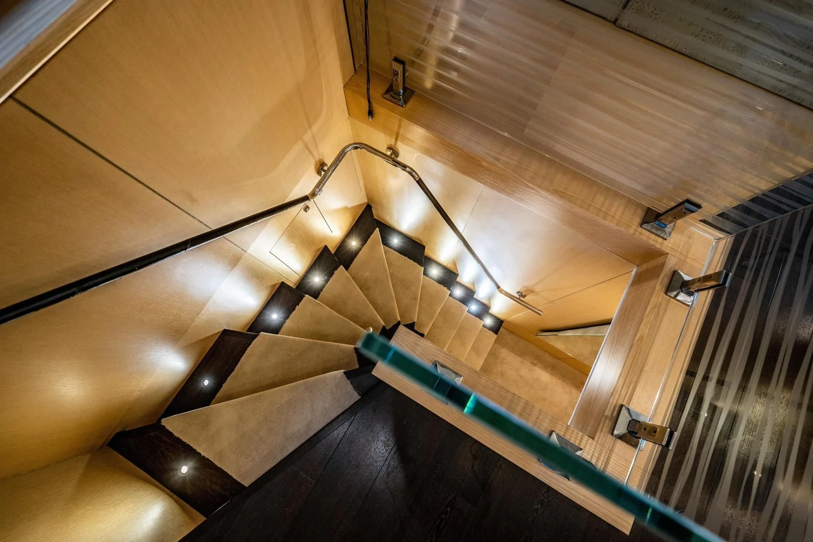 a staircase with a light aboard THE KING Yacht for Sale