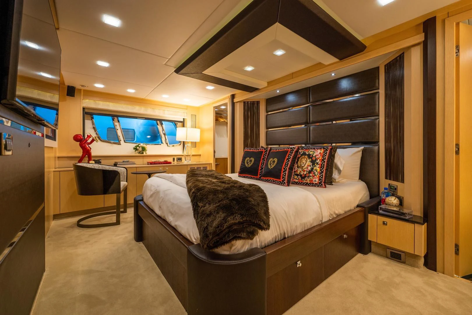 a bedroom with a bed and a tv aboard THE KING Yacht for Sale