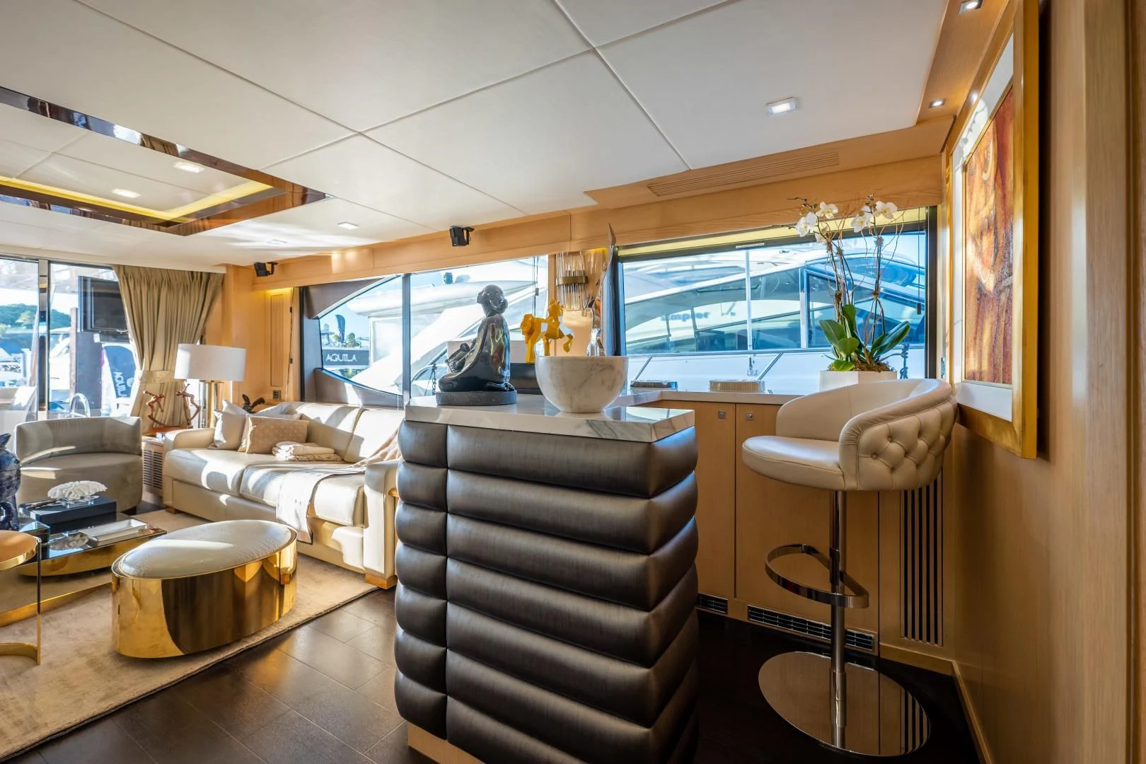 a living room with a large window aboard THE KING Yacht for Sale