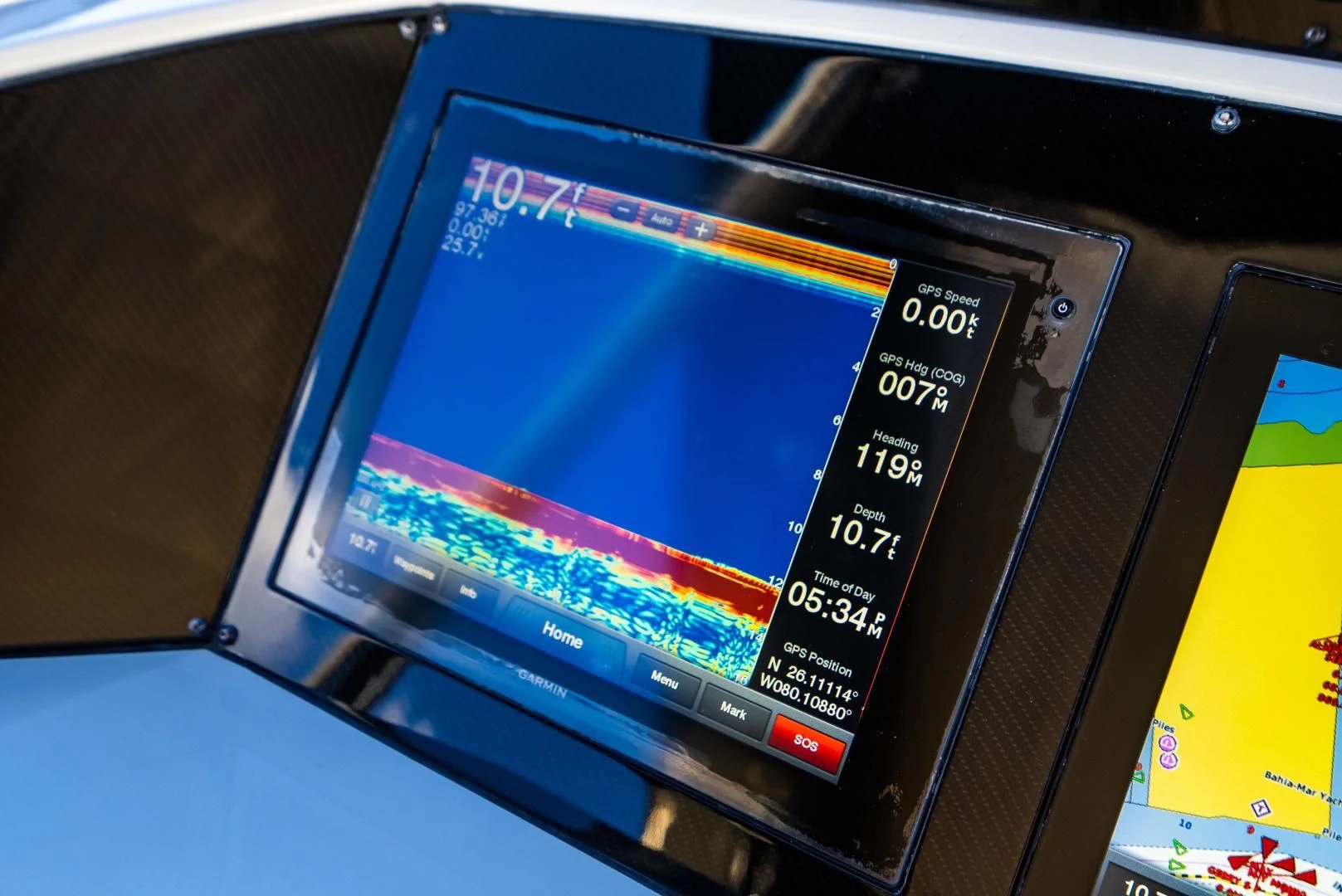 a computer screen on a table aboard THE KING Yacht for Sale