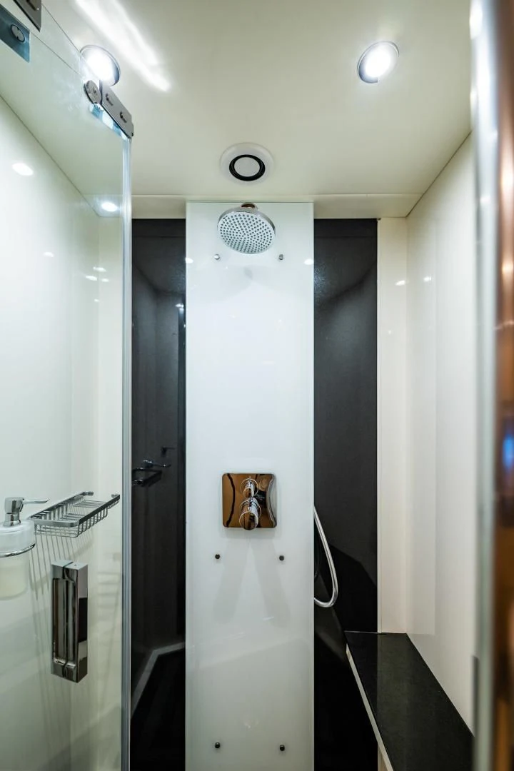 a shower with a door and a mirror aboard THE KING Yacht for Sale