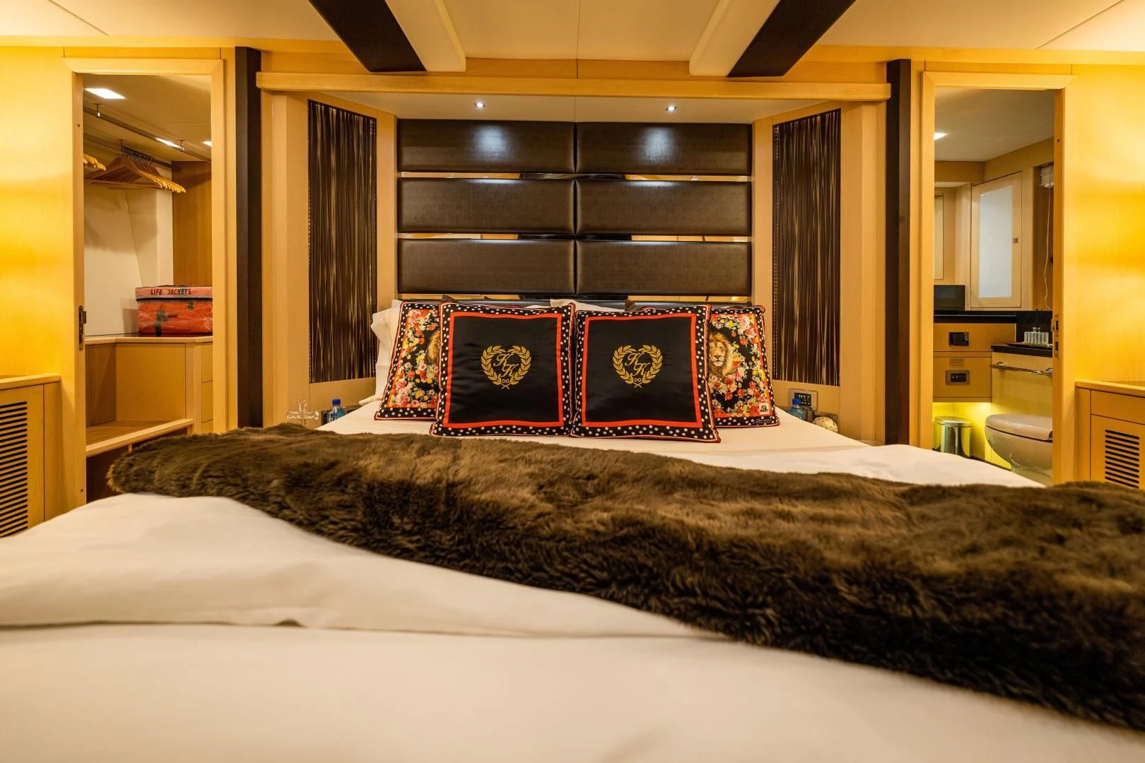 a bed with a pillow and pillows aboard THE KING Yacht for Sale