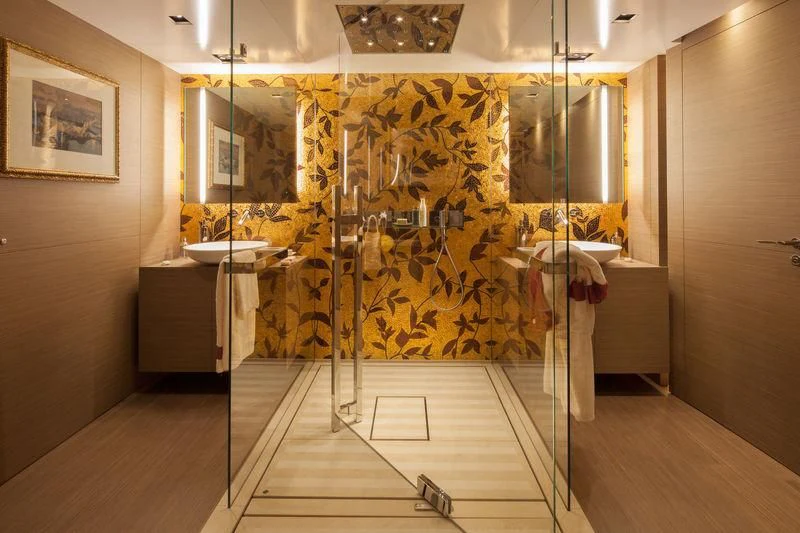 a large bathroom with a large glass shower aboard SARAMOUR Yacht for Sale