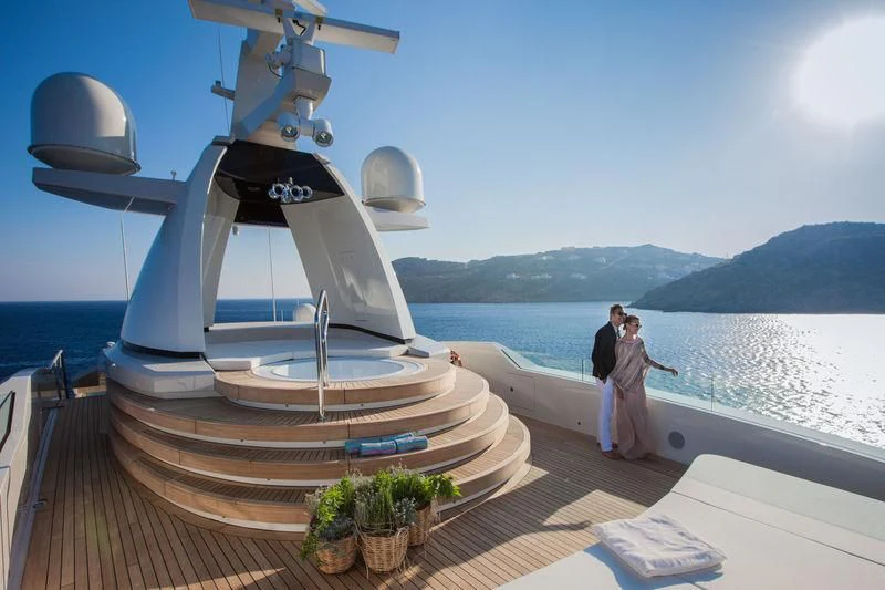 a couple kissing on a boat aboard SARAMOUR Yacht for Sale