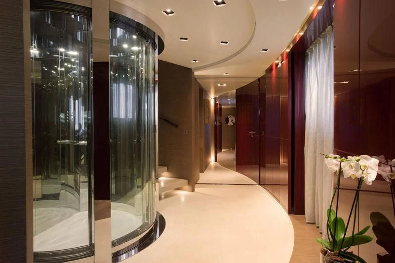 a large glass display case in a room with flowers aboard SARAMOUR Yacht for Sale