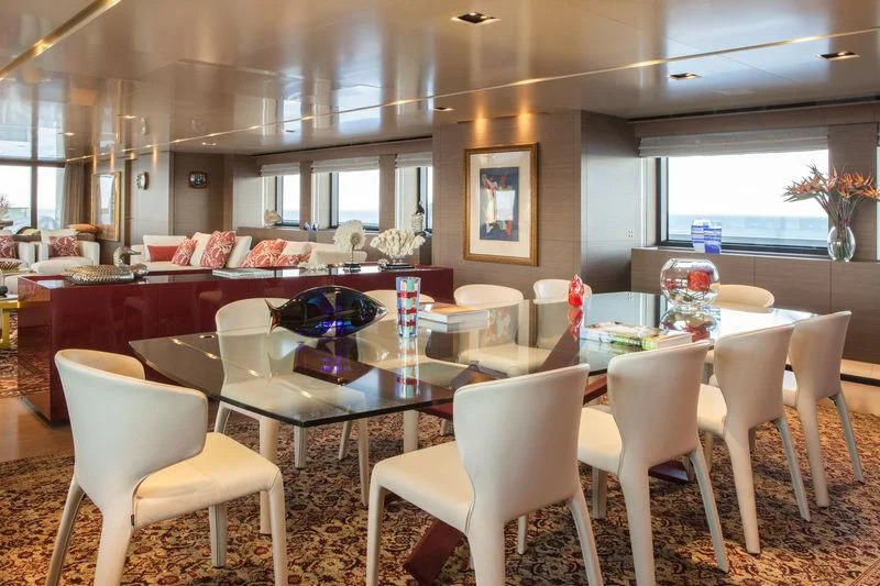 a large room with tables and chairs aboard SARAMOUR Yacht for Sale