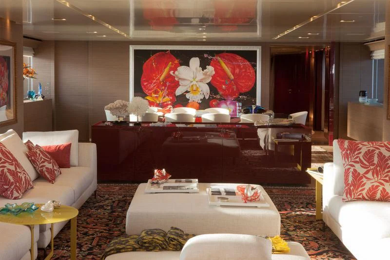 a living room with a couch and a table aboard SARAMOUR Yacht for Sale
