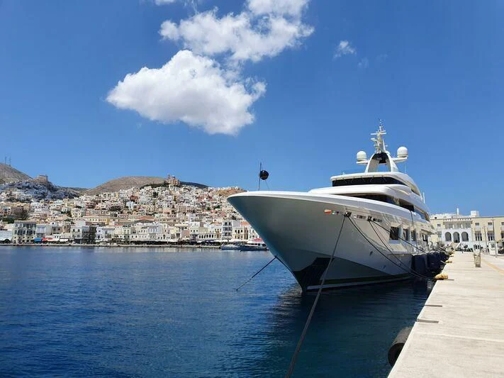 a white boat on a body of water aboard SARAMOUR Yacht for Sale