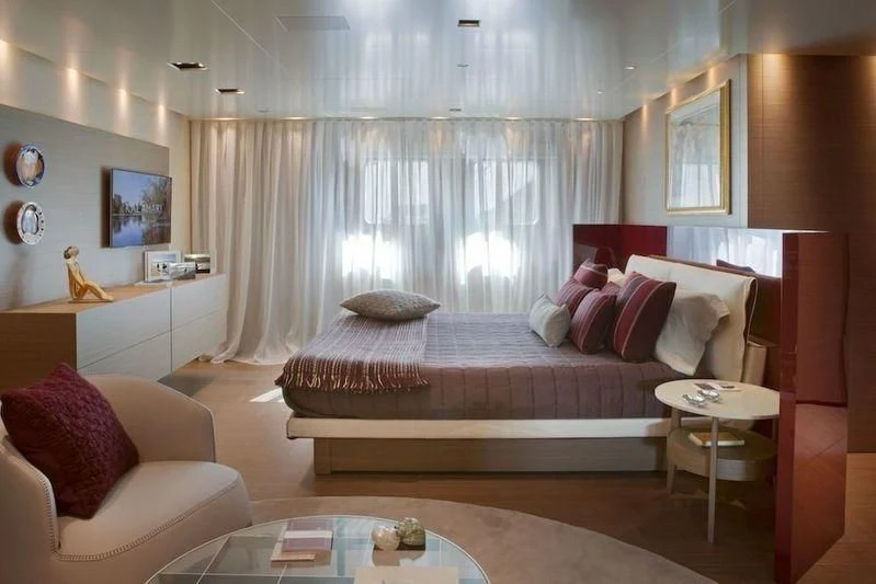 a living room with a couch and a table aboard SARAMOUR Yacht for Sale