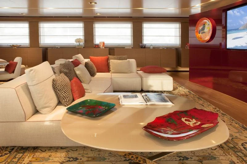 a living room with a couch and a table aboard SARAMOUR Yacht for Sale