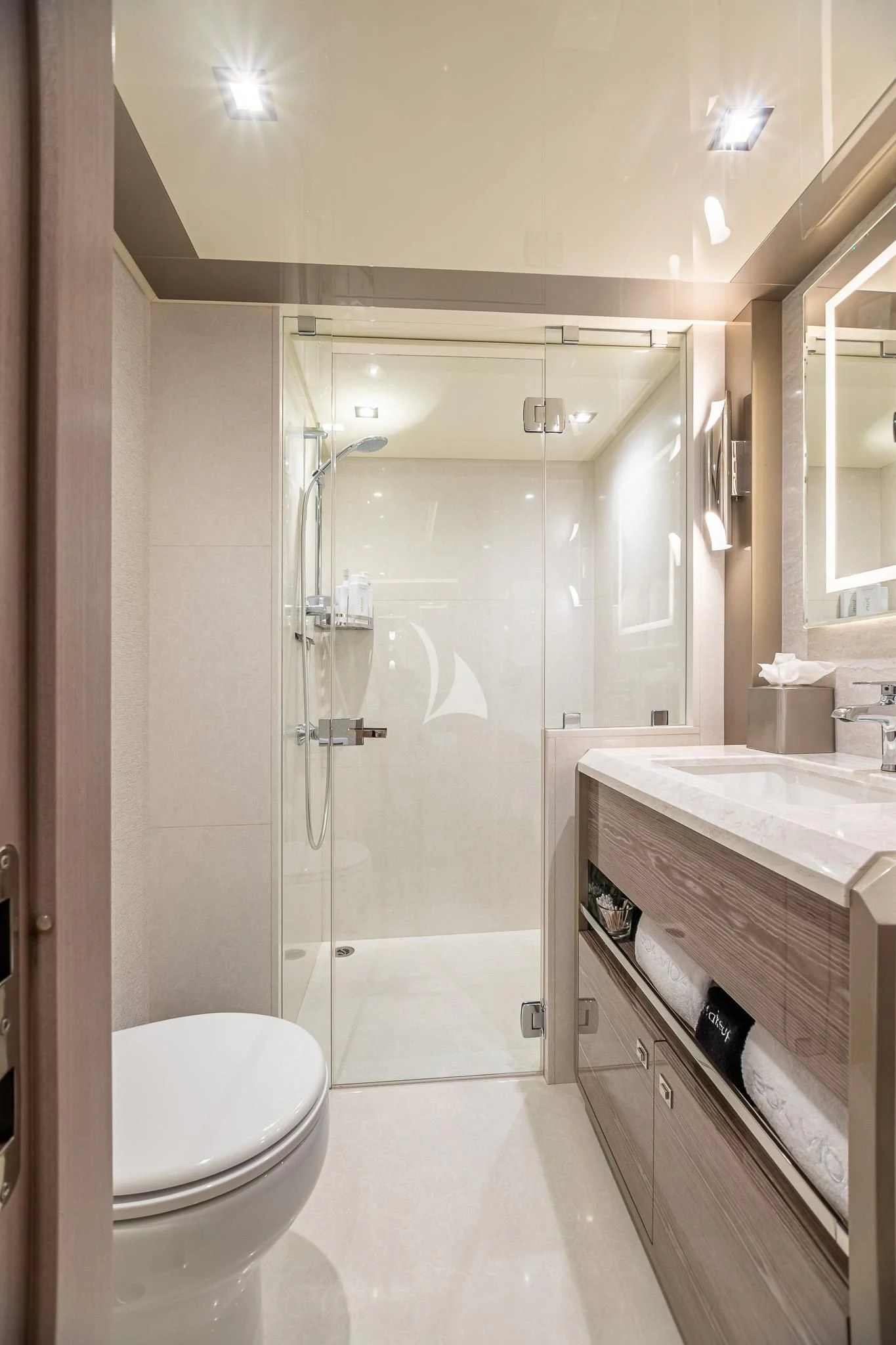 a bathroom with a glass shower aboard BOA VIDA Yacht for Sale