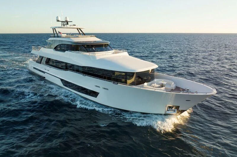 a white yacht on the water aboard BOA VIDA Yacht for Sale