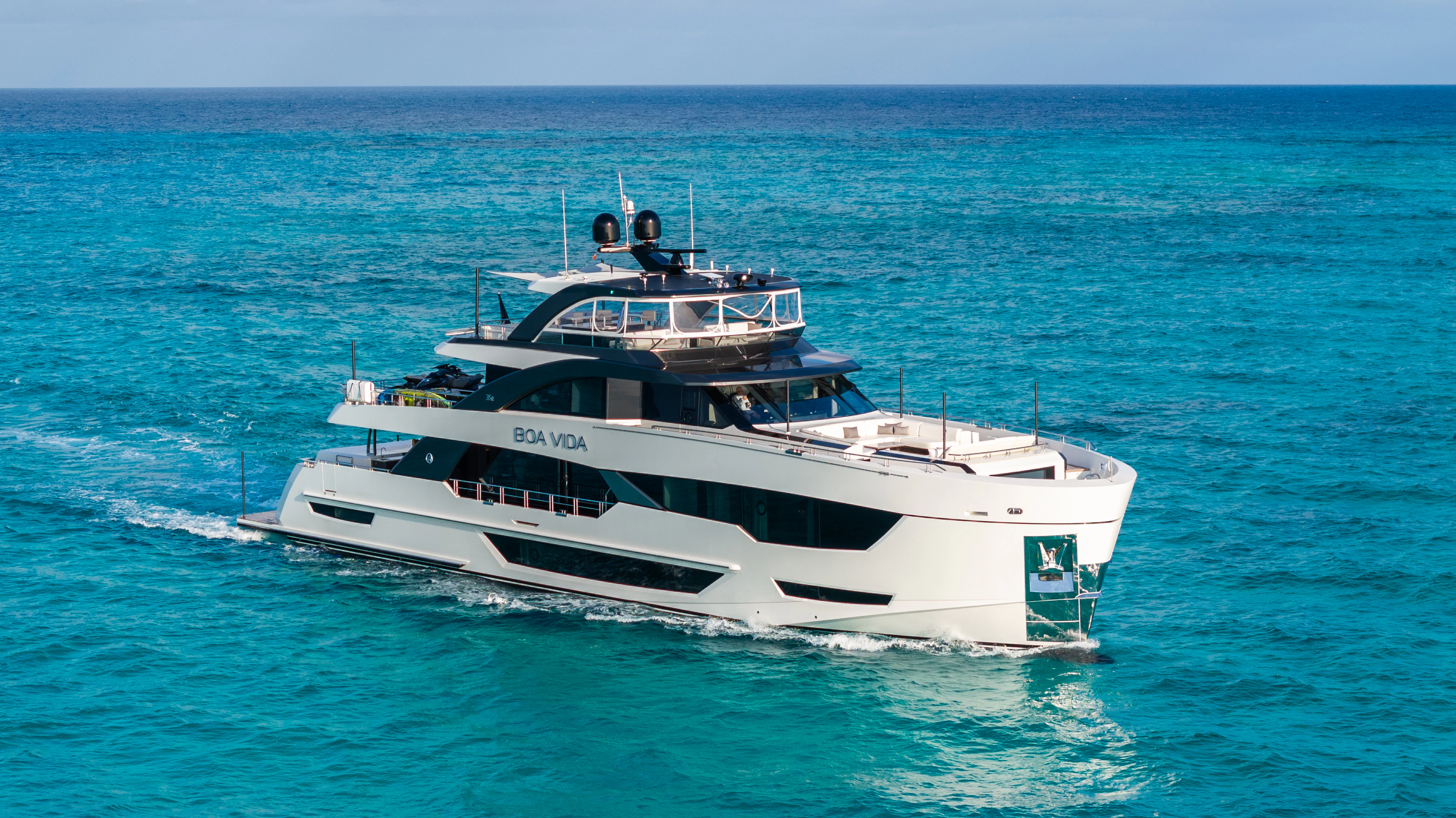 a white boat in the water aboard BOA VIDA Yacht for Sale