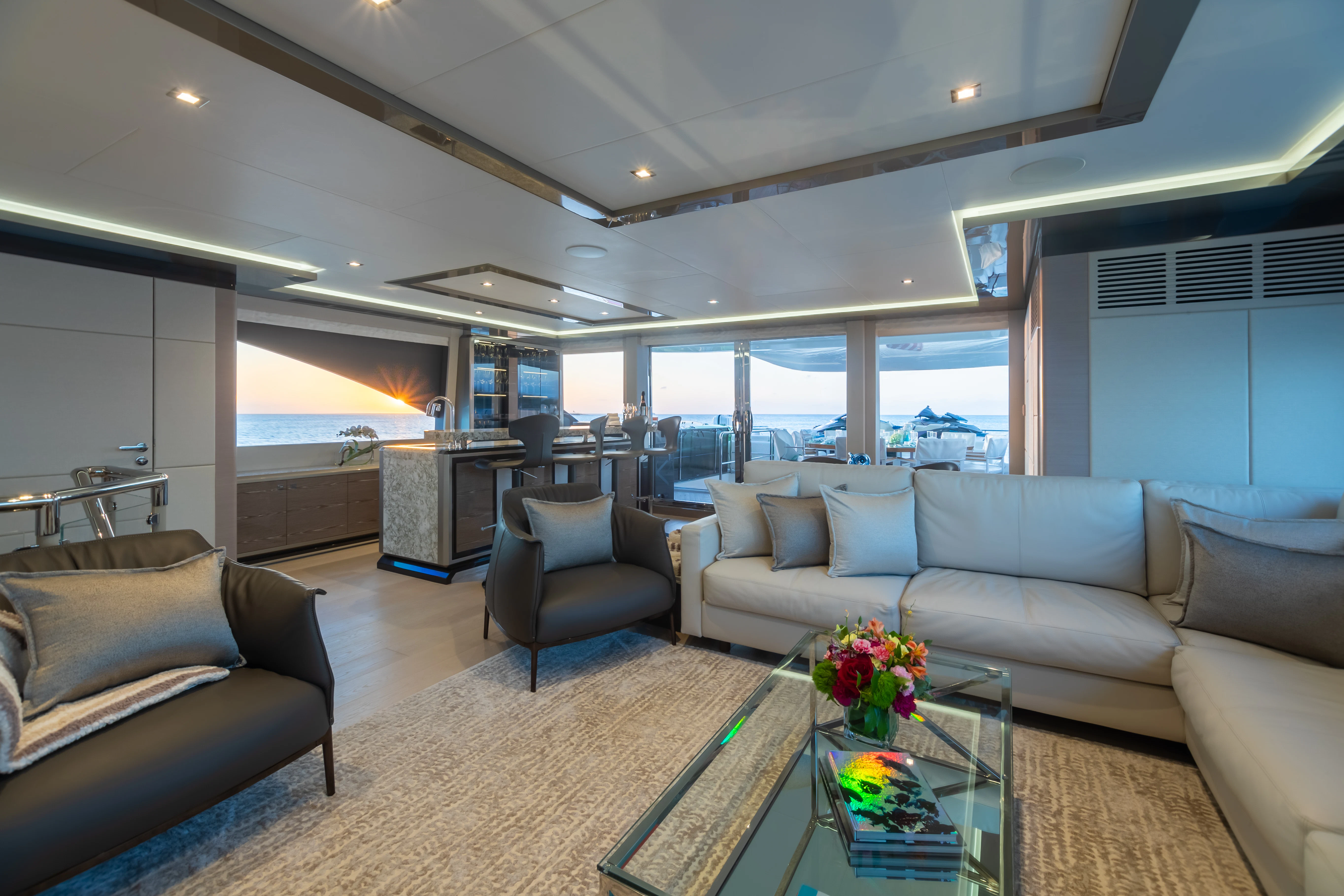 a living room with a large window aboard BOA VIDA Yacht for Sale