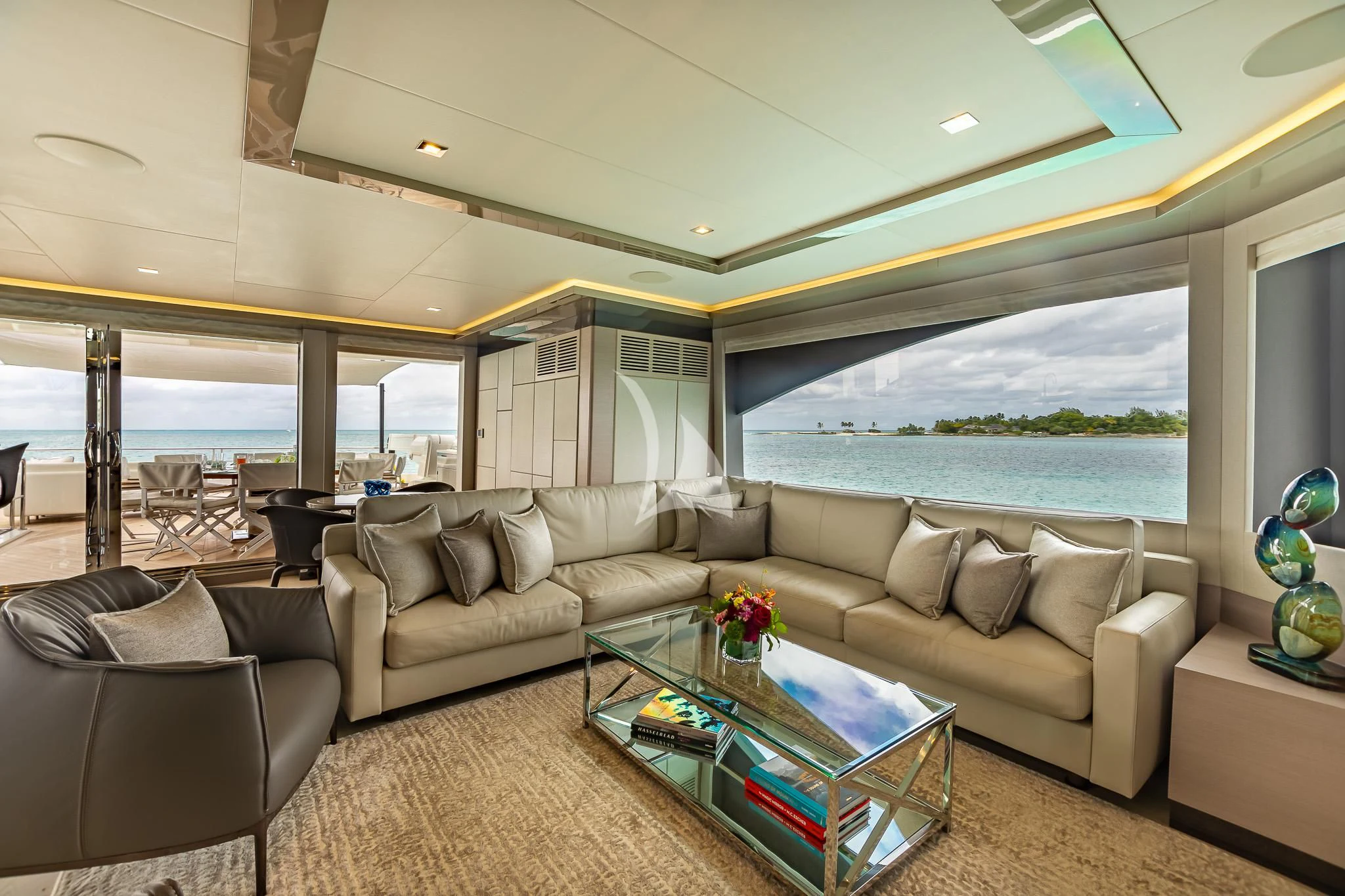 a living room with a large window aboard BOA VIDA Yacht for Sale