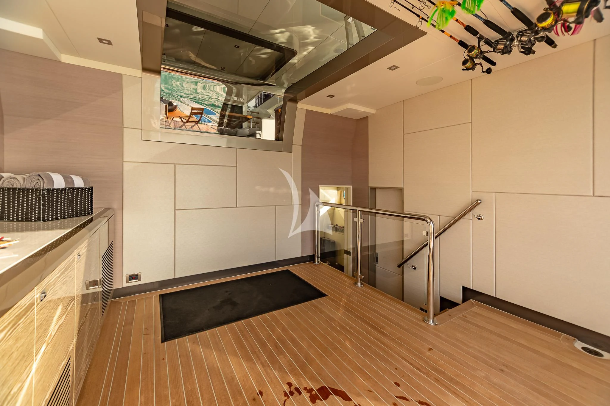 a room with a wood floor and a large mirror aboard BOA VIDA Yacht for Sale
