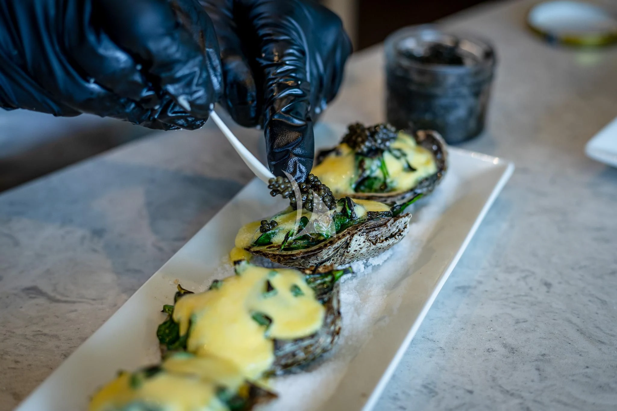 a person cutting a piece of food aboard BOA VIDA Yacht for Sale