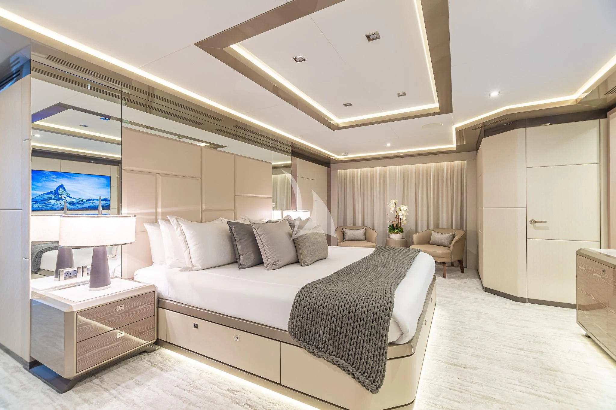 a bedroom with a bed and a tv aboard BOA VIDA Yacht for Sale