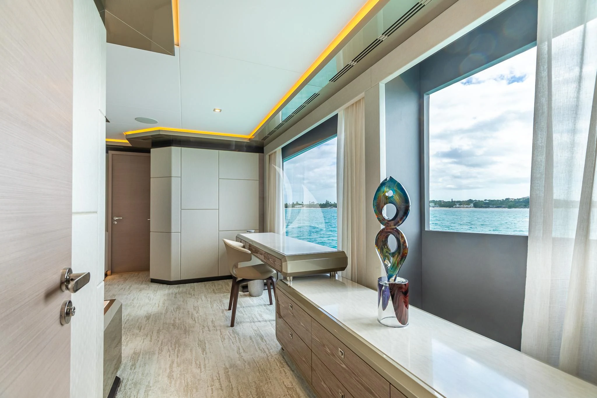a room with a table and a window aboard BOA VIDA Yacht for Sale