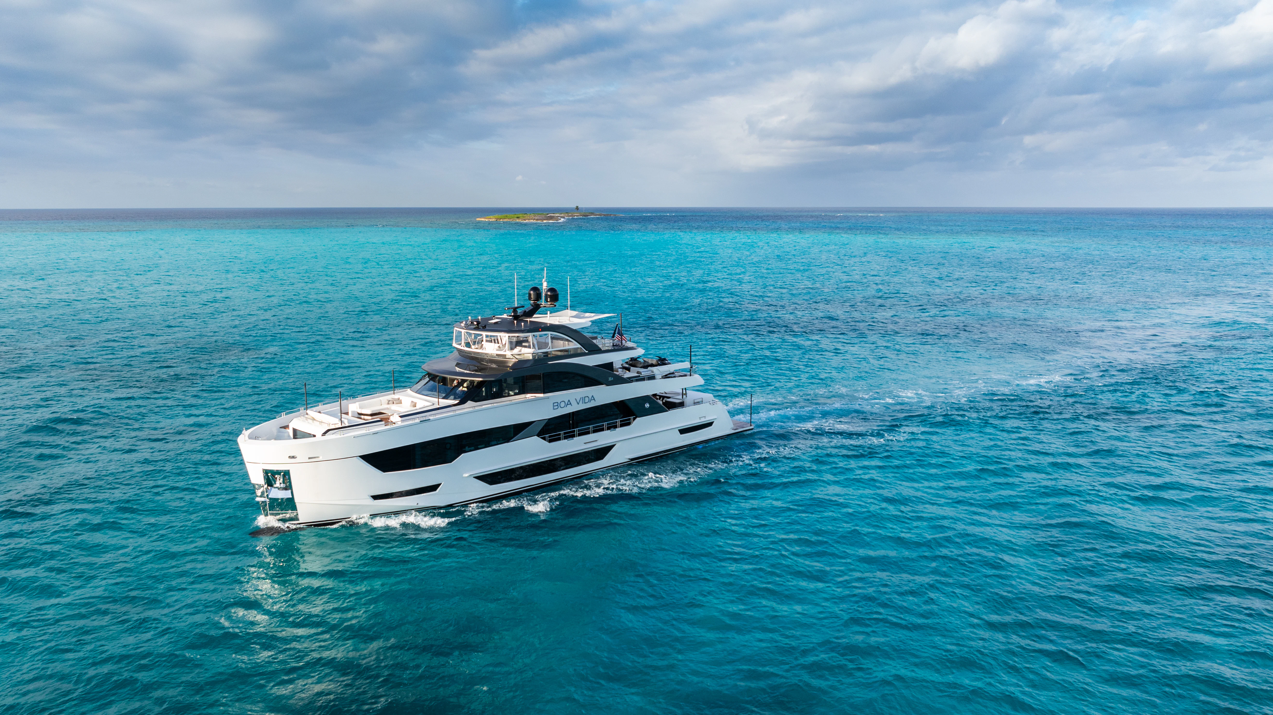 a white boat in the water aboard BOA VIDA Yacht for Sale