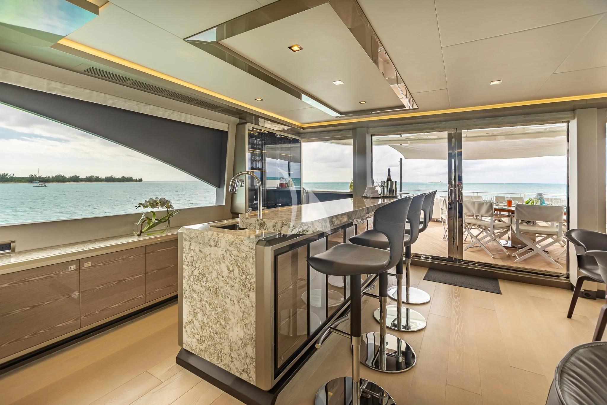 a kitchen with a large window overlooking the ocean aboard BOA VIDA Yacht for Sale