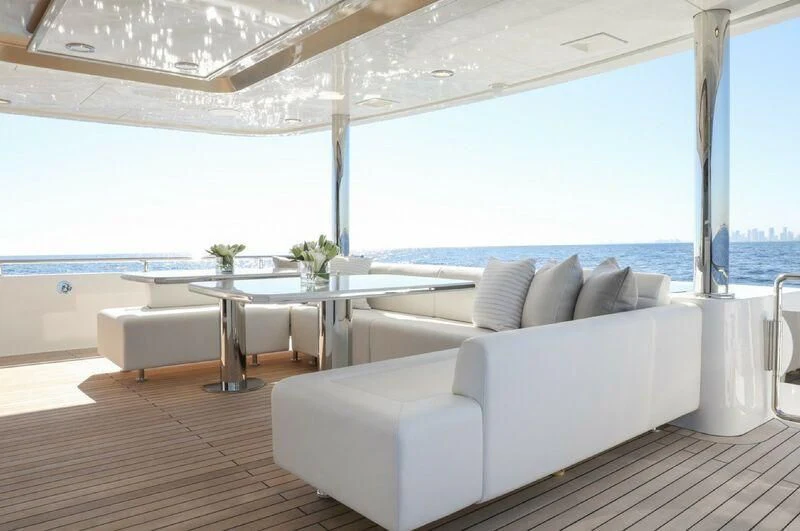 a room with a couch and a table aboard BOA VIDA Yacht for Sale