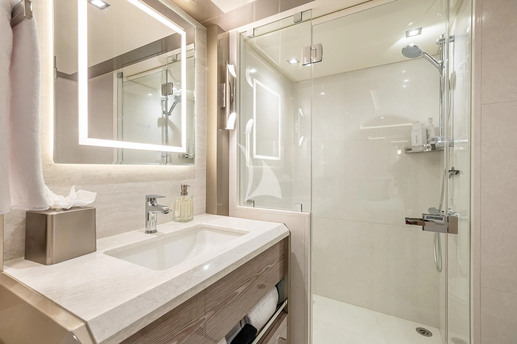 a bathroom with a glass shower aboard BOA VIDA Yacht for Sale