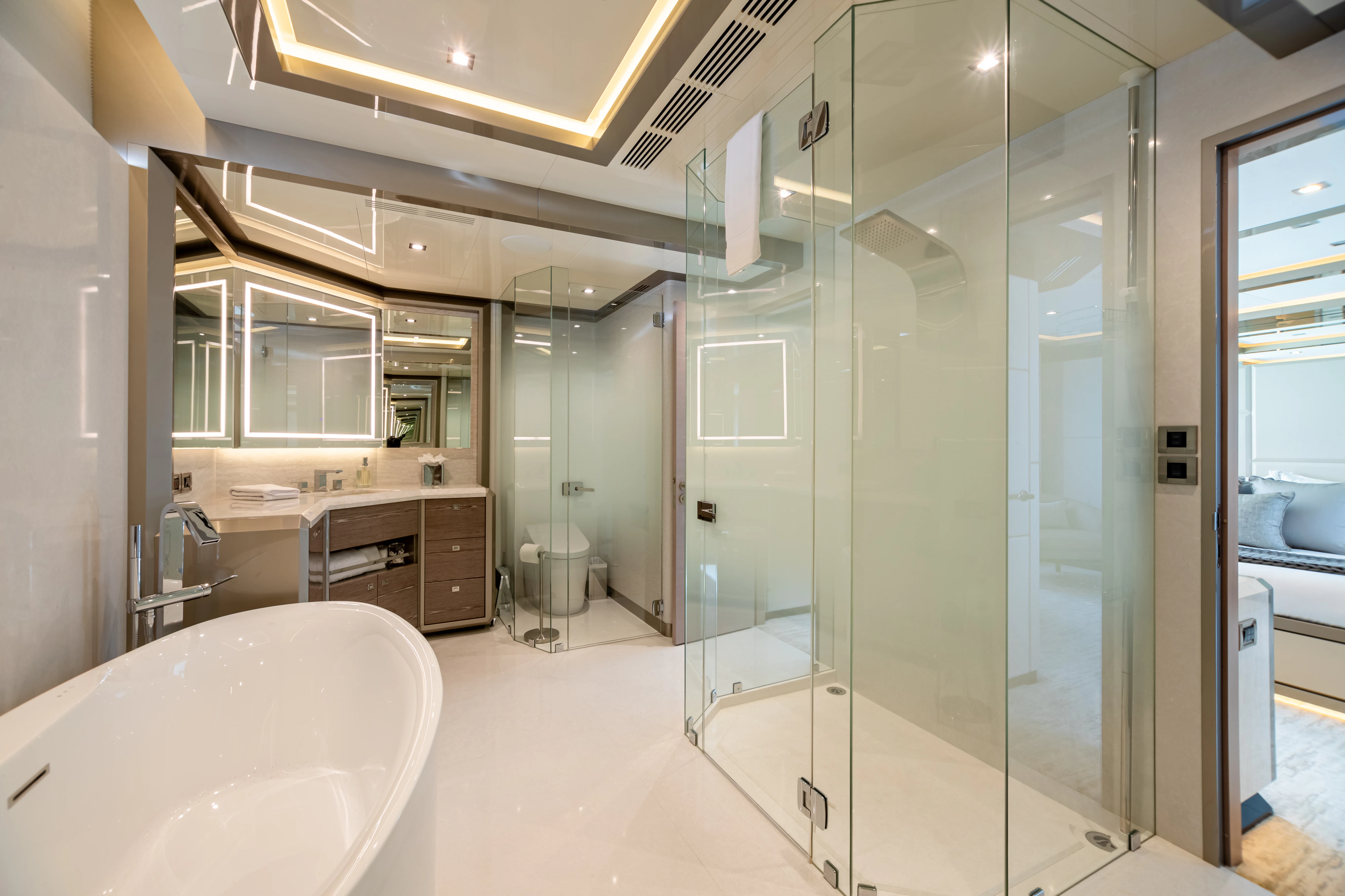 a bathroom with a glass shower aboard BOA VIDA Yacht for Sale