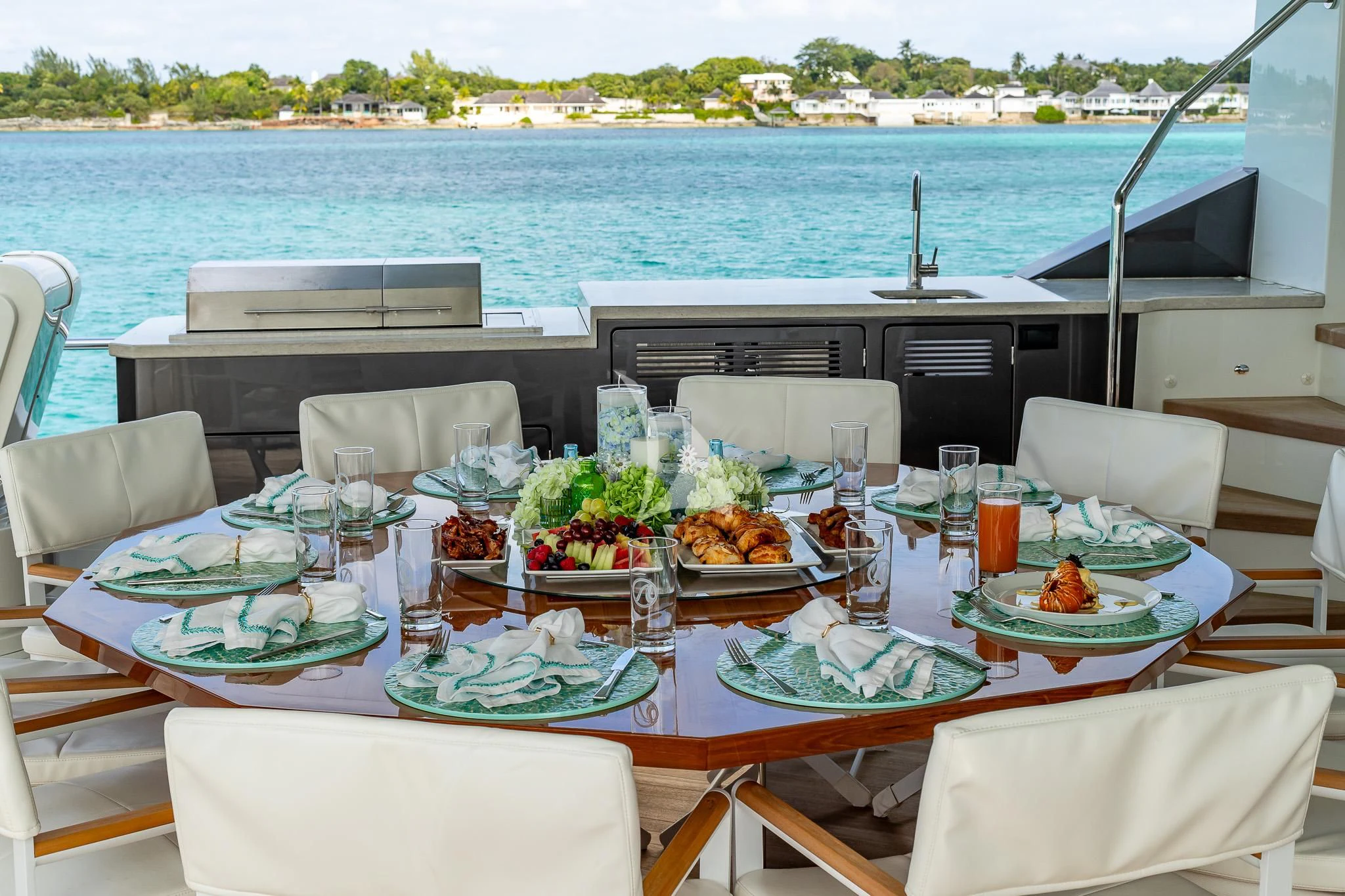 a table set with food and drinks aboard BOA VIDA Yacht for Sale