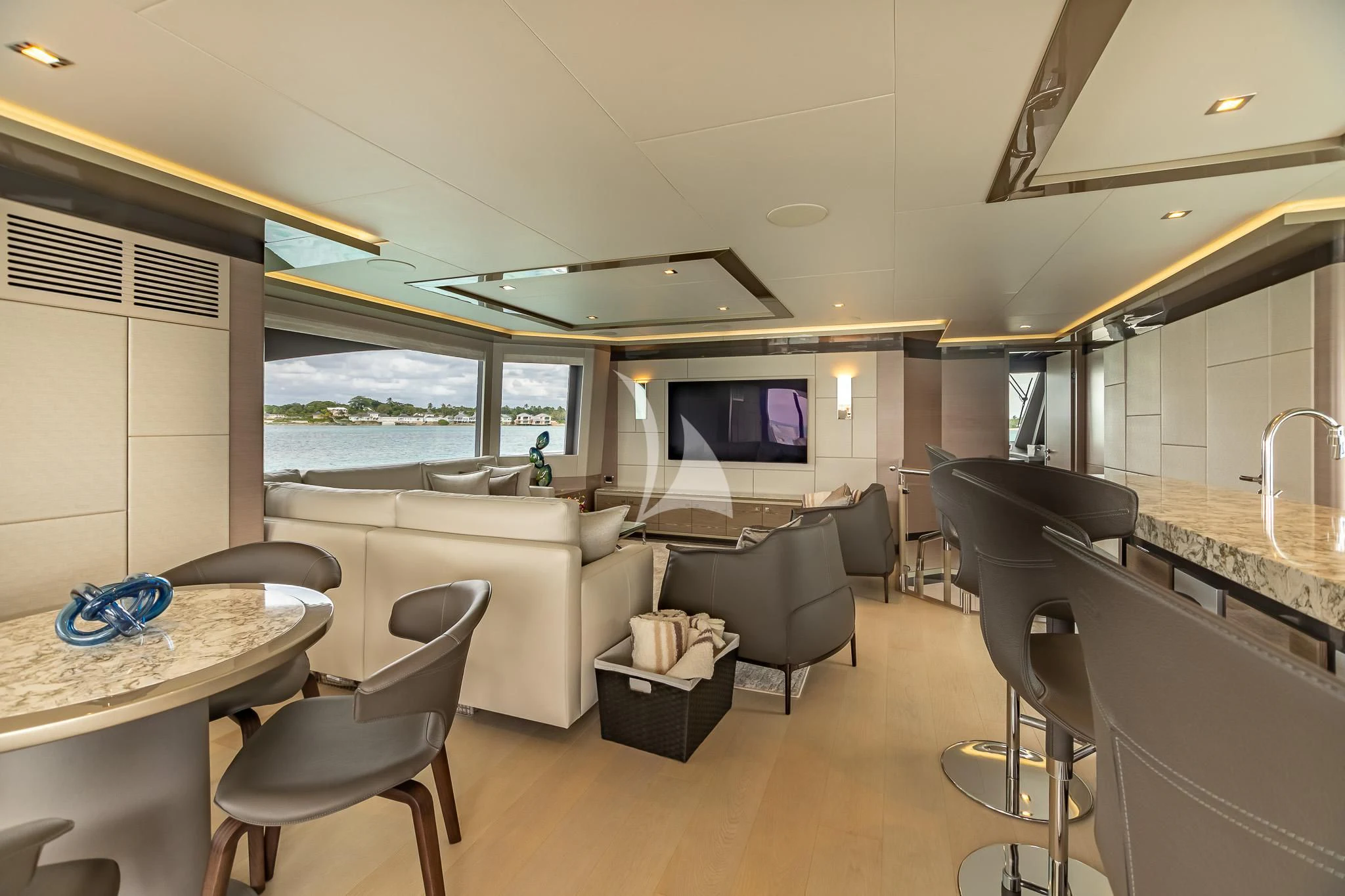 a living room with a large window aboard BOA VIDA Yacht for Sale
