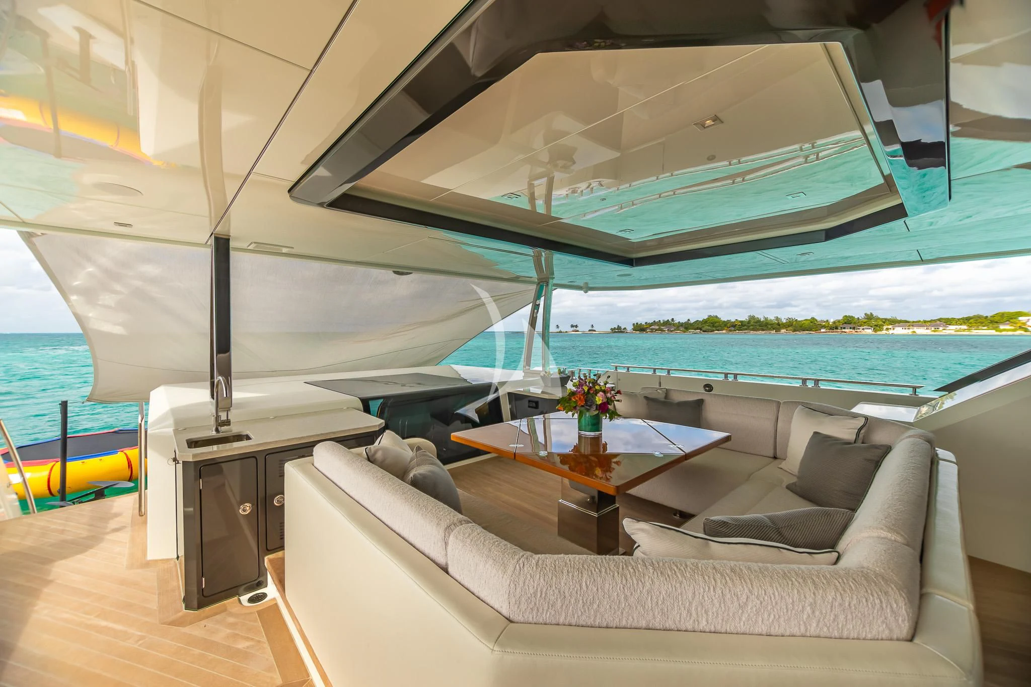 a room with a couch and a pool aboard BOA VIDA Yacht for Sale
