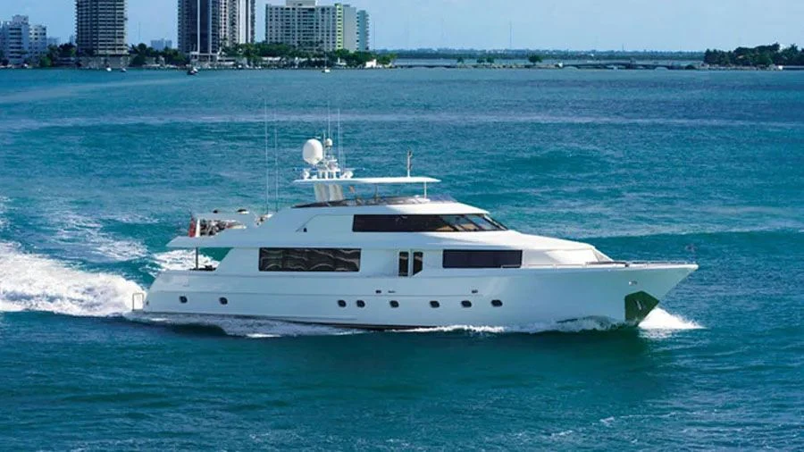 a white yacht in the water aboard FRISKY LADY Yacht for Sale