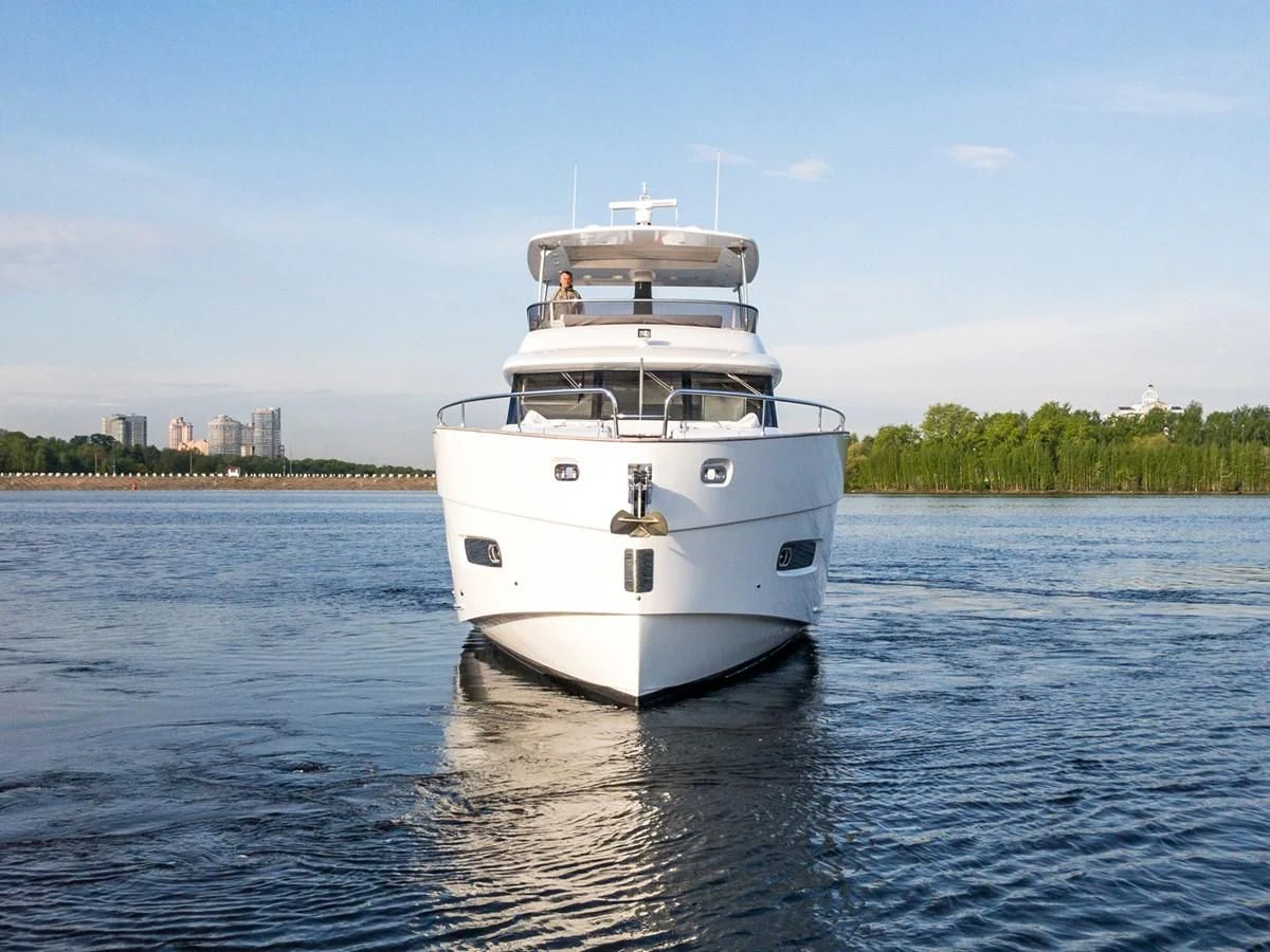 a white boat on the water aboard MAGELLANO 66 Yacht for Sale
